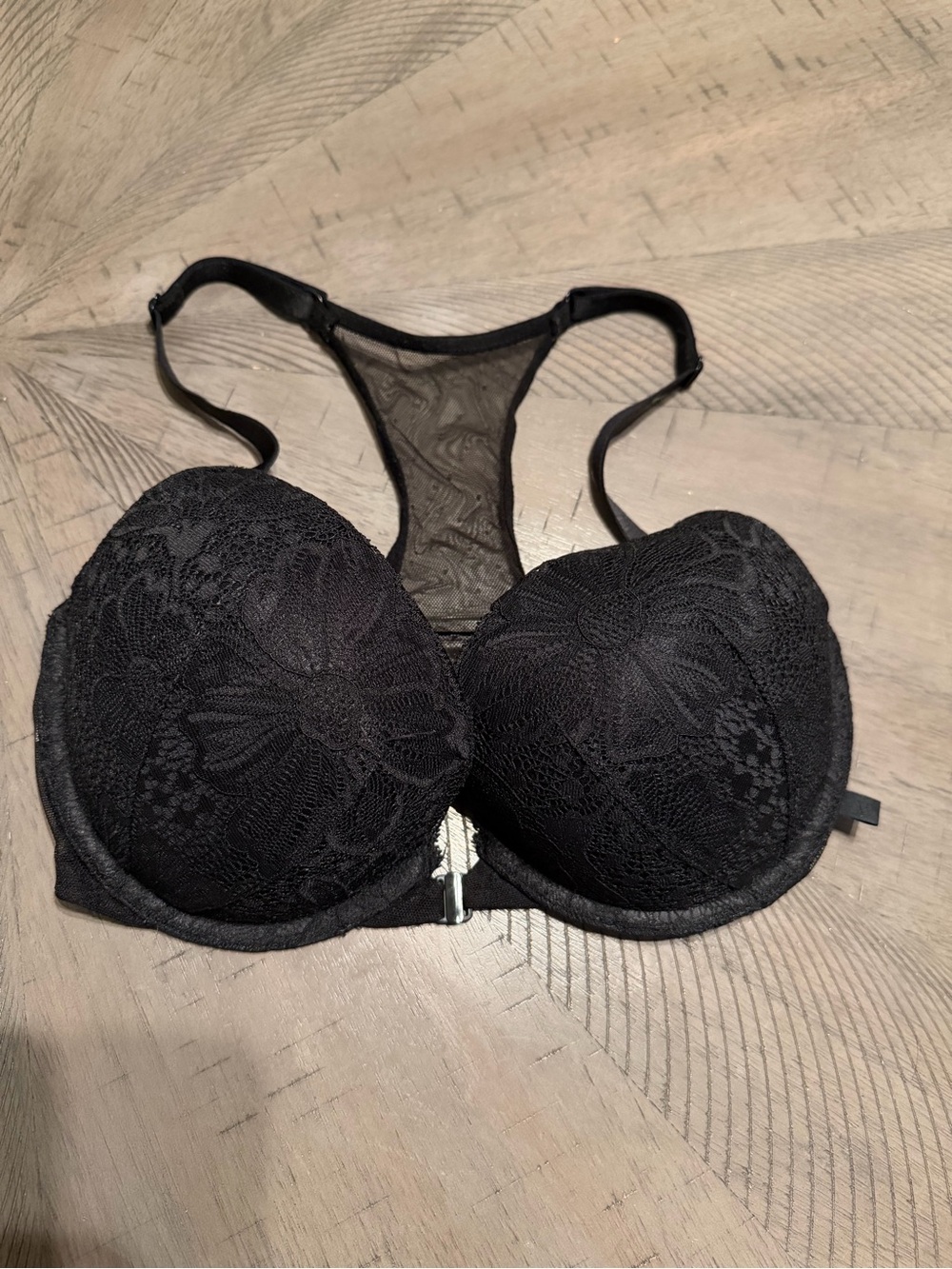 Victoria's Secret Black Lace Racerback Push-Up Bra with Floral Overlay.